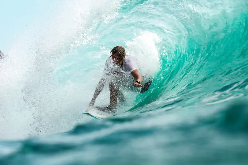 Group of students learning to surf together at Kuta Beach